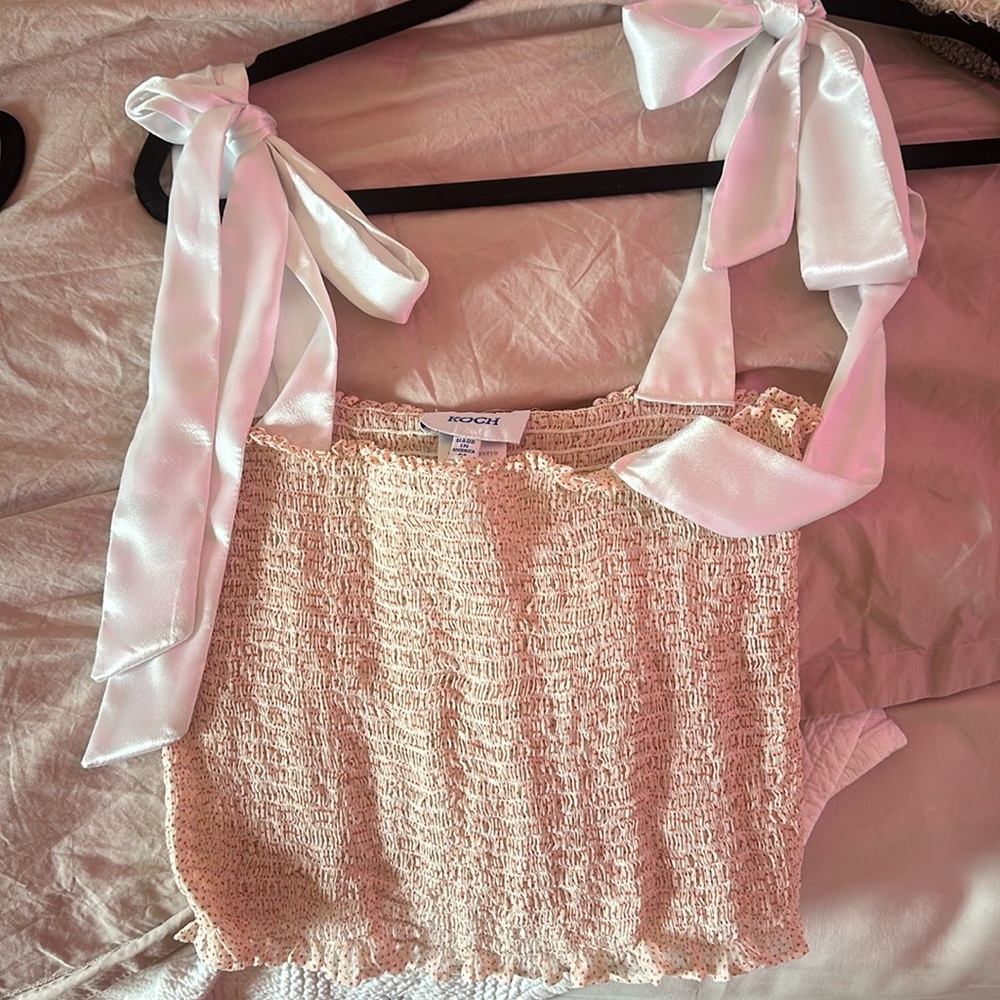 Light pink polka dot tube top with white ribbons from shop Koch.